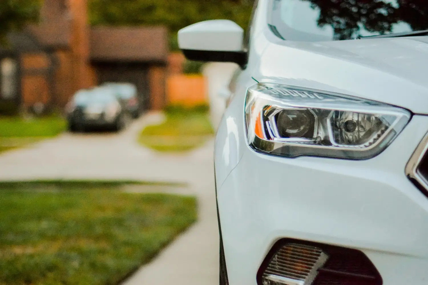 White SUV parked in a Bay Area residential driveway